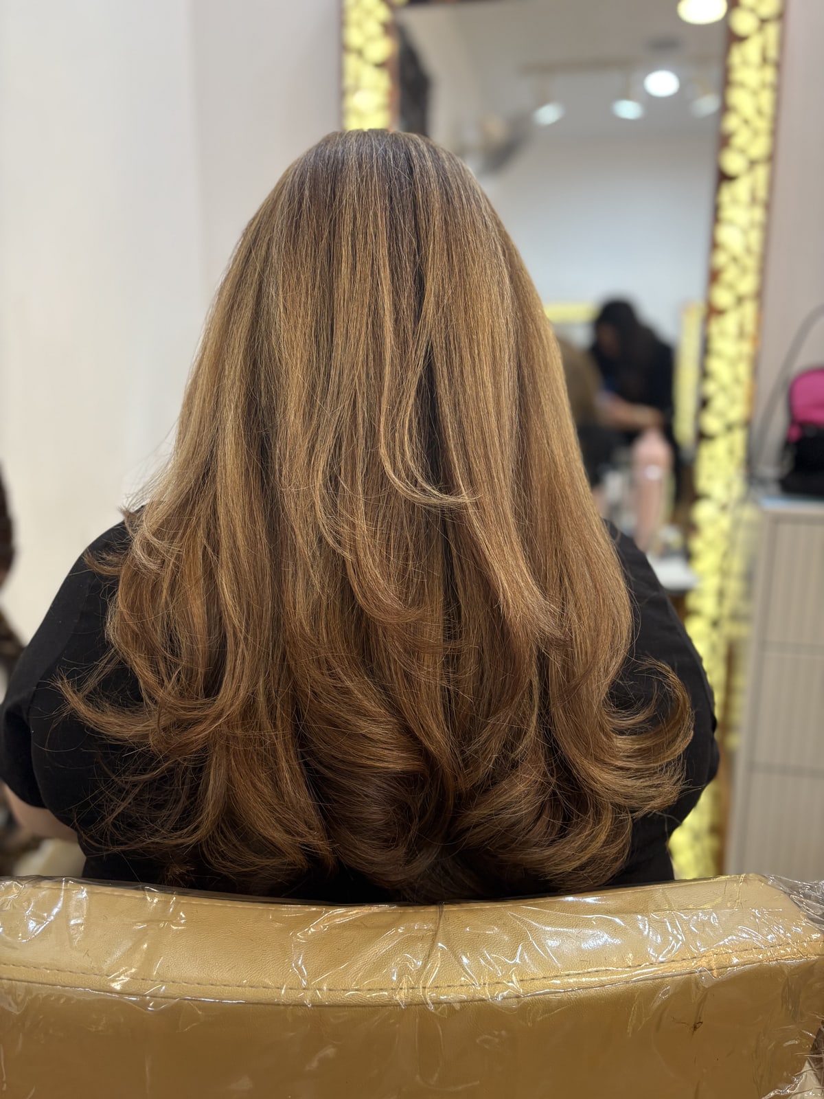 Precision haircut with a wavy blow-dry finish at Frenzy Salon
